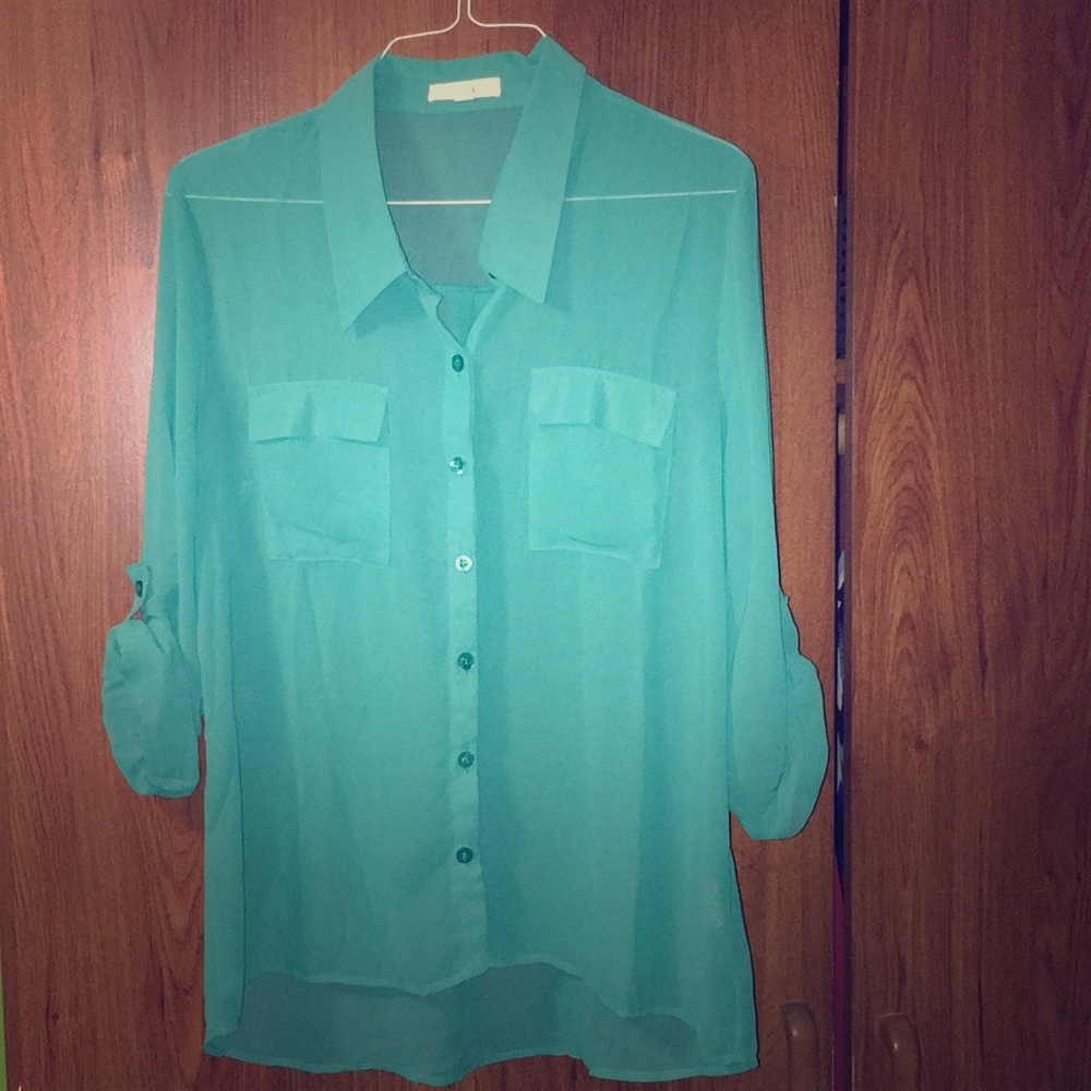Sheer. Lightweight. Rolled sleeves.